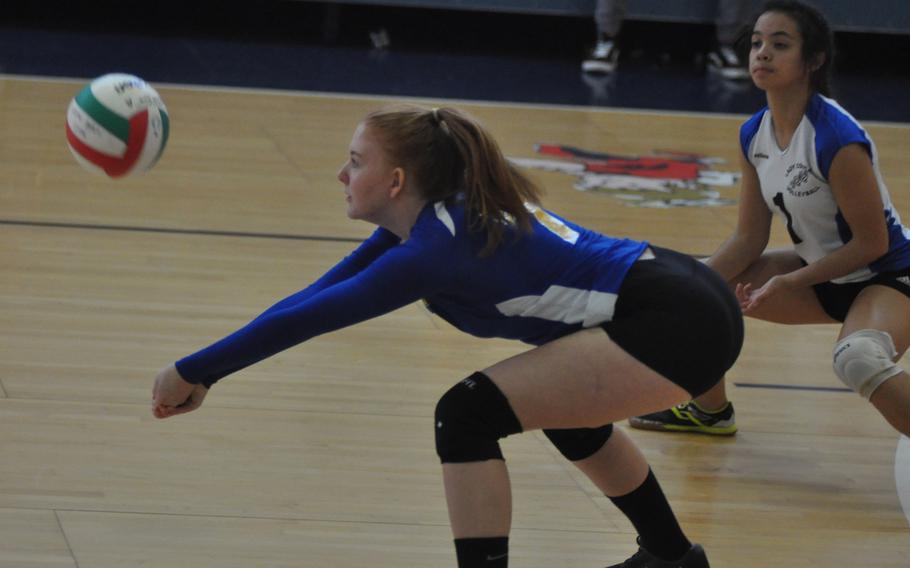 Ansbach's Jessica Livingston digs the ball in the Cougars' 25-15, 25-11, 25-13 loss to Sigonella on Saturday.