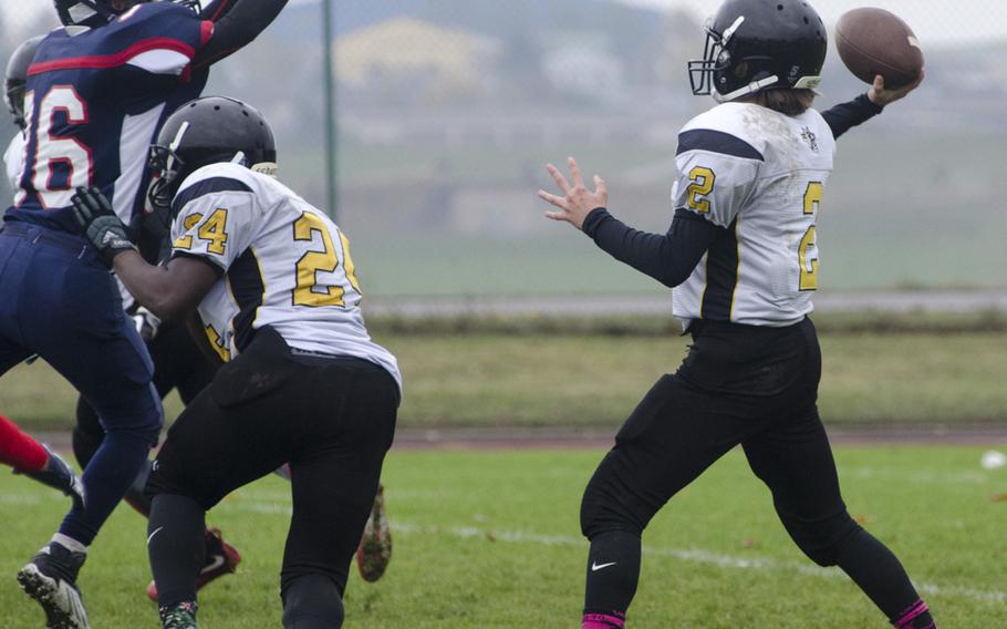 Donovan Gragg of Vicenza launches a pass against a heavy Bitburg rush during a DODEA-Europe Division II quarterfinal matchup, Saturday, Oct. 22, 2016 at Bitburg, Germany. Gragg and Vicenza were unable to score against a stifling Barons defense, falling 40-0.