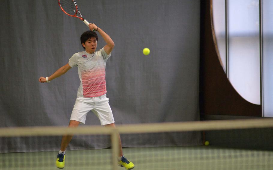 International School of Brussels's Yuki Takeuchi goes high to return a shot from American Overseas School of Rome in a boys doubles semifinal at the DODEA-Europe tennis championships in Wiesbaden, Germany, Friday, Oct. 28, 2016. He and fellow ISB #1 teammate Victor della Faille beat AOSR 6-1, 6-1, to advance to Saturday's final against Ramstein.