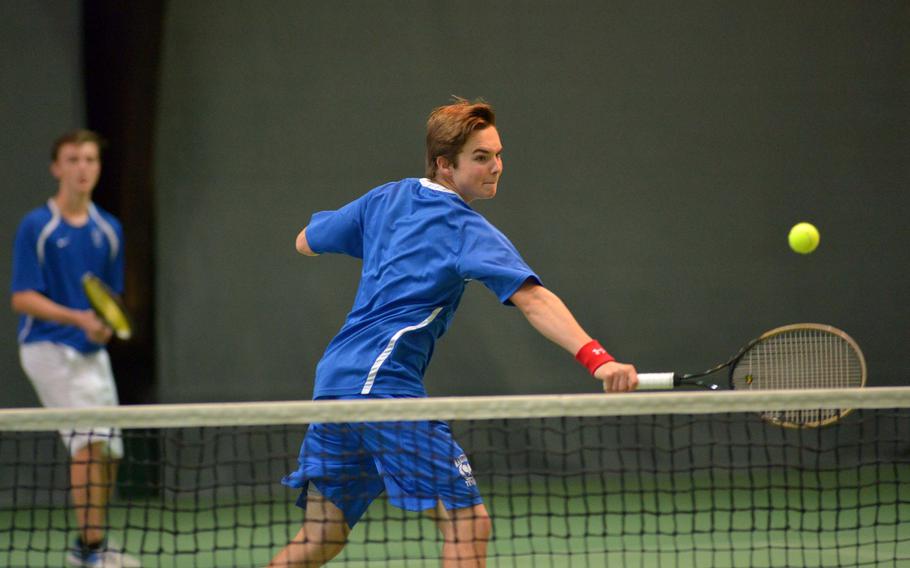 Ramstein's Ben Mouritsen backhands a shot across the net against International School of Brussels Team #2 in a boys doubles semifinal at the DODEA-Europe tennis championships in Wiesbaden, Germany, Friday, Oct. 28, 2016. Mouritsen and teammate Grady Gallagher advanced to Saturday's final after ISB's Gianluca Curti was injured in the second set.