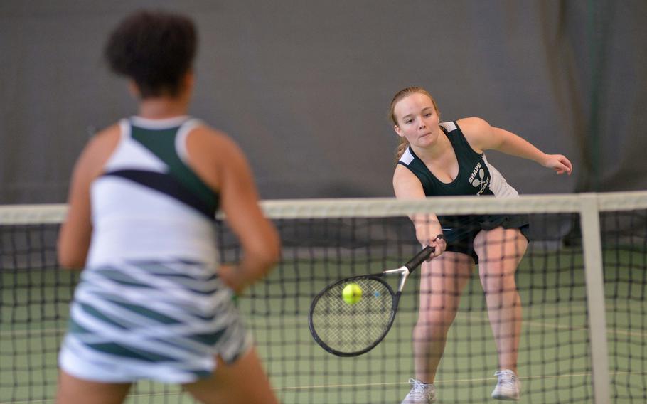 SHAPE's Evelyn Brunelle returns a shot at the net against Naples' Lindsey Plavcan in the girls doubles third-place match at the DODEA-Europe tennis championships in Wiesbaden, Germany, Saturday Oct. 29, 2016. Brunelle and teammate Synnoeve Lillefosse beat Plavcan and teammate Jade Sawyer 3-6, 6-1, 6-3.