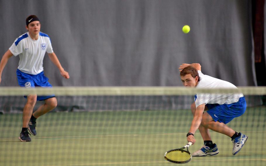 Ramstein's Grady Gallagher, right, watches his ball sail over the net, as teammate Ben Mouritsen watches in the boys doubles final at the DODEA-Europe tennis championships in Wiesbaden, Germany, Saturday Oct. 29, 2016. The Ramstein team lost to International School of Brussels' Yuki Takeuchi and Victor della Faille 6-3, 7-5.