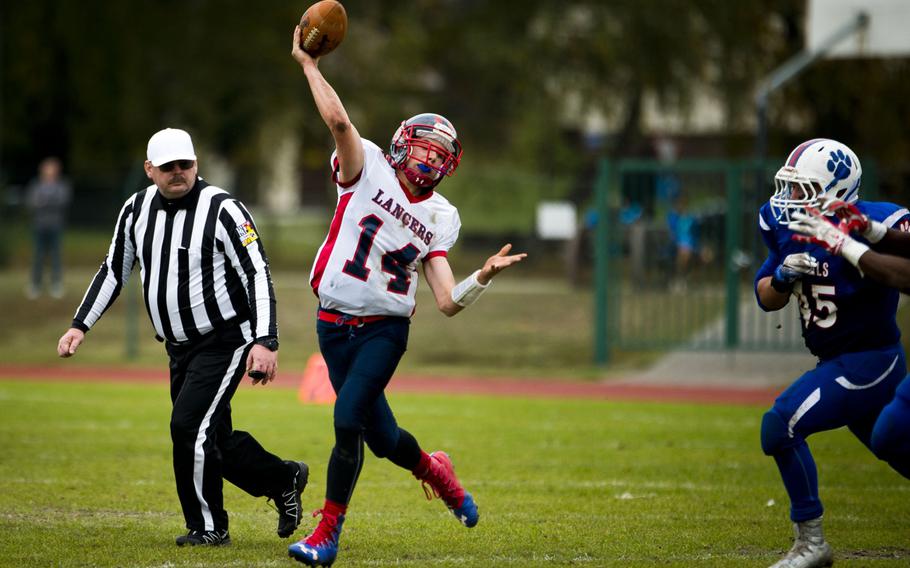 Lakenheath's Tyler England throws a pass at Ramstein Air Base, Germany, on Saturday, Oct. 29, 2016. Lakenheath lost the DODEA-Europe Division I semifinal game against Ramstein 58-15.