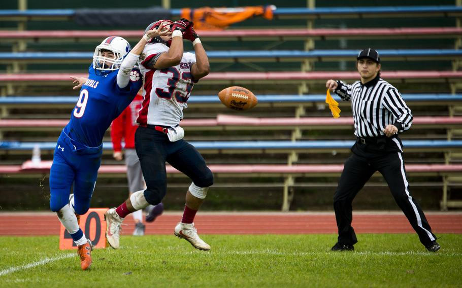 Lakenheath's Christopher Cruz, right, tries to catch a pass over Ramstein's Ryan Morgan during the DODEA-Europe Division I semifinal at Ramstein Air Base, Germany, on Saturday, Oct. 29, 2016. Lakenheath lost the game 58-15.