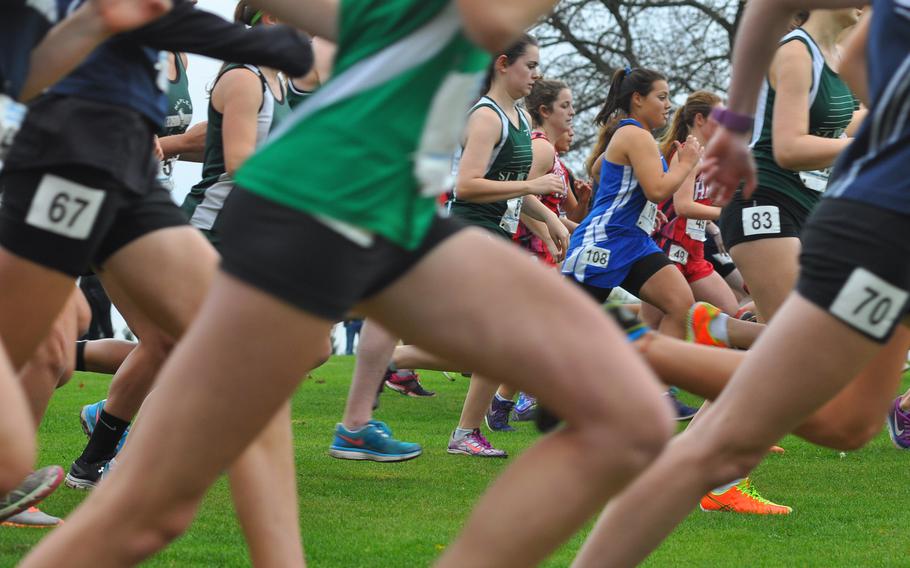 Runners sprint for position at the start of the girls' race on Saturday at the 2016 DODEA European cross country championships in Baumholder, Germany.