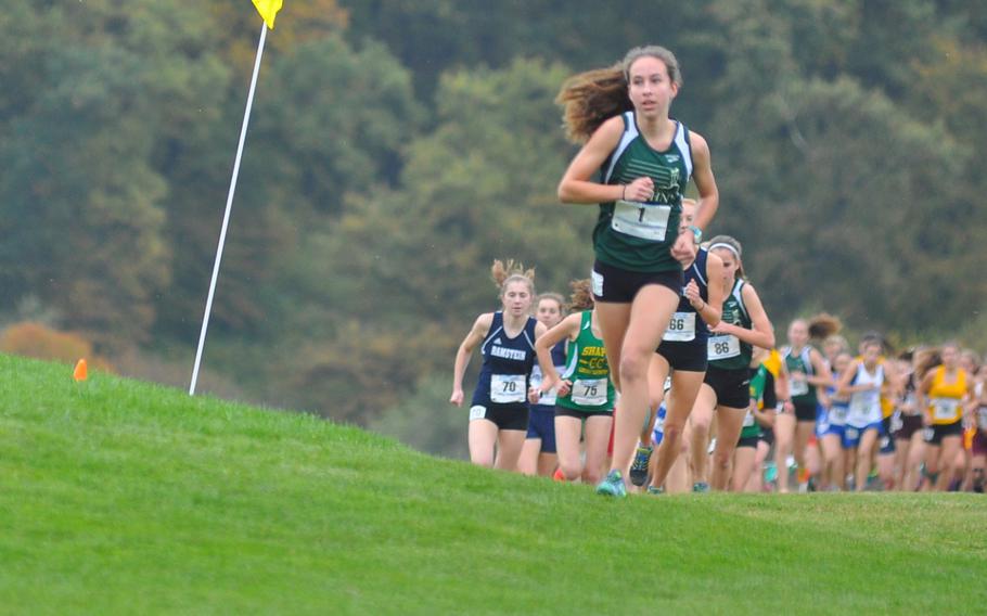 Kayla Smith runs at the front of the pack on Saturday at the 2016 DODEA European cross country championships in Baumholder, Germany. Smith repeated as the girls' champion, setting a new course record in the process.