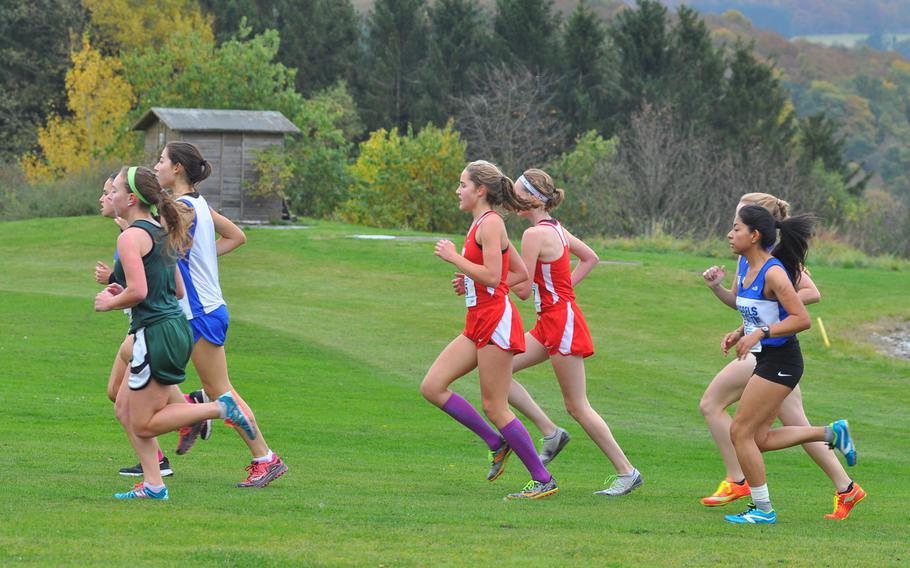 A pack of runners loops around Baumholder's Army Golf Course on Saturday at the 2016 DODEA European cross country championships in Baumholder, Germany.