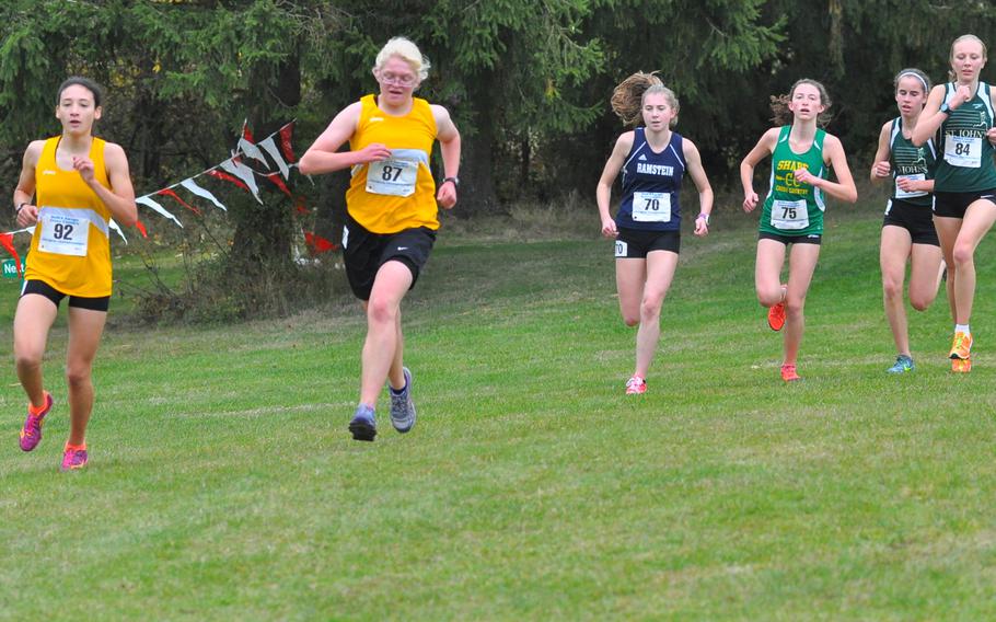 The lead pack behind St. John's Kayla Smith stayed together throughout most of the girls' race Saturday at the 2016 DODEA European cross country championships in Baumholder, Germany. Towards the end of the first of two loops on Baumholder's golf course, the runners,from left, were: Stuttgart's Tatiana Smith and Rachel Dickenson; Ramstein's Katelyn Schultz, SHAPE's Holly Moser, and St. John's Sydney Smith and Sofia Jegnell. Schultz and Jegnell went on to finish second and third behind Kayla Smith.
