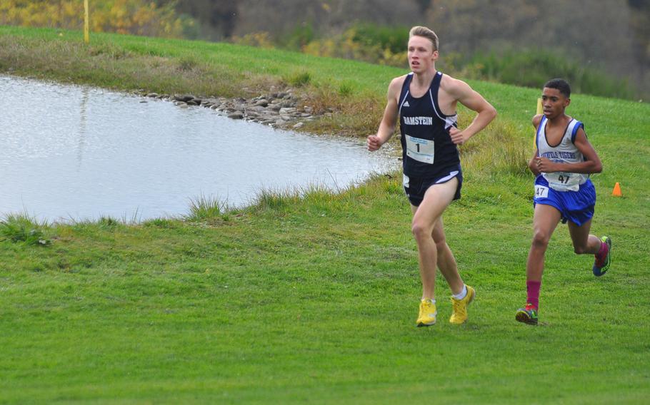 Ramstein's Colin McLaren and Hohenfels' Jeremias Serrano-Velez run together during the first of two loops Saturday on the five-kilometer course on Baumholder's Army Golf Course. McLaren went on to win the boys' race at the 2016 DODEA European cross country championships in course-record time. Serrano-Velez finished third.