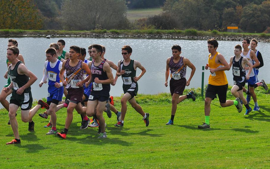 A pack of runners race past a small pond on the Baumholder Army Golf Course on Saturday. The runners were competing in the 2016 DODEA European cross country championships in Baumholder, Germany.