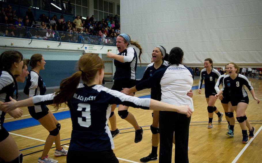 Black Forest Academy celebrates winning their DODEA-Europe Division II semifinal match against Aviano at Vogelweh, Germany, on Friday, Nov. 4, 2016. Black Forest Academy won 24-26, 25-20, 25-9 and 25-14.