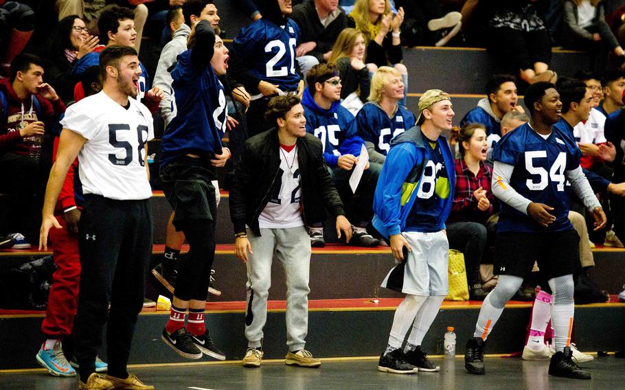 Fans cheer for the blue team during a DODEA-Europe Volleyball All-Star match in Kaiserslautern, Germany, on Saturday, Nov. 12, 2016.