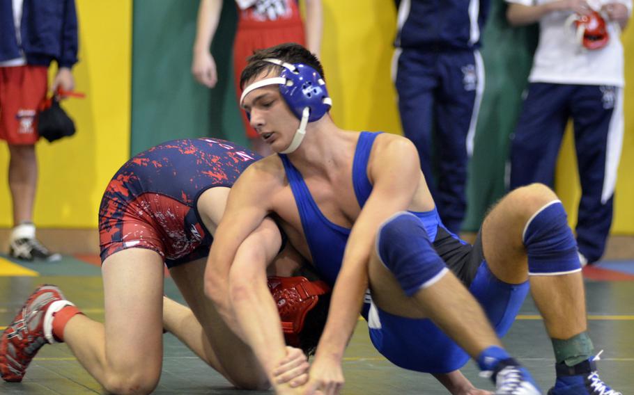 Brussels wrestler Bohdan Polovynko works to control Lakenheath's Joseph Rowberry at 160 pounds during the first high school wrestling tournament of the season at RAF Alconbury, England, Saturday, Dec. 3, 2016.