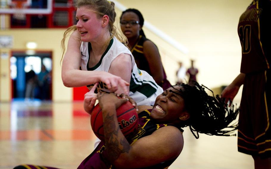 Alconbury's Hayley Star, left, battles Baumholder's Eliyah Tillman for the ball in Baumholder, Germany, on Saturday, Dec. 10, 2016. Alconbury lost the game 31-12.