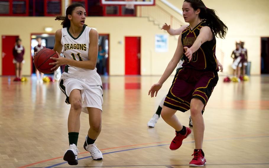 Alconbury's Kira Thorn, left, looks for a pass around Baumholder's Taylor Lynch in Baumholder, Germany, on Saturday, Dec. 10, 2016. Alconbury was defeated 31-12.