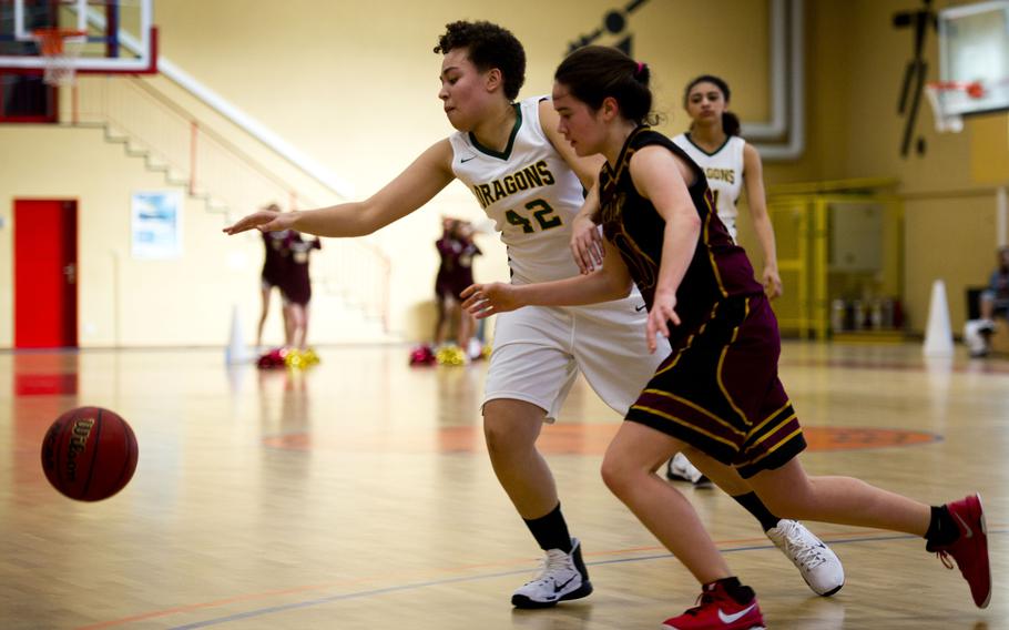 Alconbury's Gia Gonzalez, left, and Baumholder's Taylor Lynch race for the ball in Baumholder, Germany, on Saturday, Dec. 10, 2016. Alconbury lost the game 31-12.