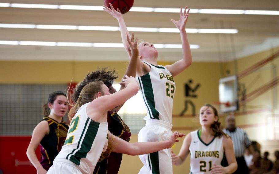 Alconbury's Marissa Kastler, jumps for a rebound in Baumholder, Germany, on Saturday, Dec. 10, 2016. Alconbury was defeated by Baumholder 31-12.