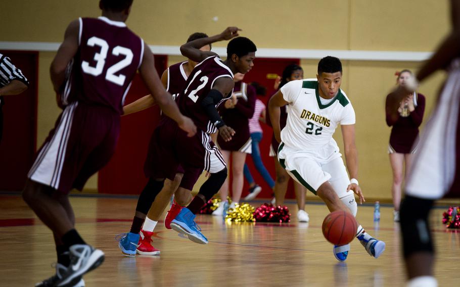 Alconbury's Anthony Stewart, right, dribbles around Baumholder's Nate Horton in Baumholder, Germany, on Saturday, Dec. 10, 2016. Alconbury lost the game 61-36.