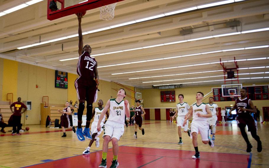 Baumholder's Nate Horton, left, goes for a layup in Baumholder, Germany, on Saturday, Dec. 10, 2016. Baumholder won the game against Alconbury 61-36.