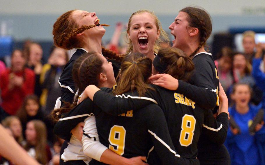 The Stuttgart Panthers celebrate their 25-18, 25-19, 25-23 win over the Ramstein Royals in the Division I final at the DODEA-Europe volleyball championships in Kaiserslautern, Germany, Saturday, Nov. 5, 2016.