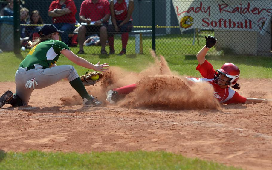 Kaiserslautern's Tierra Kienle slides into home as SHAPE's Hailey Van Valkenburg tries to put on  the tag. Kaiserslautern beat SHAPE 11-6 in a Division I game at the DODEA-Europe softball championships in Ramstein, Germany, Thursday, May 26, 2016.