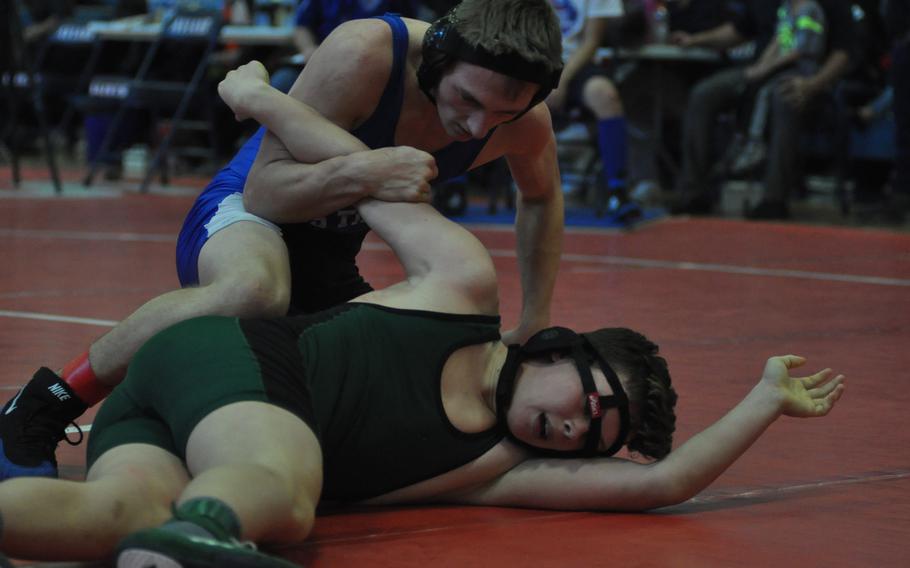 Hohenfels' Jaden Masterson takes control of Naples' Raymond Gregorich in a 152-pound match Saturday, Jan. 14, 2017, at Aviano Air Base, Italy. Gregorich's teammate, Jordan Hoffman, would eventually get some revenge for his teammate by downing Masterson to stay unbeaten.