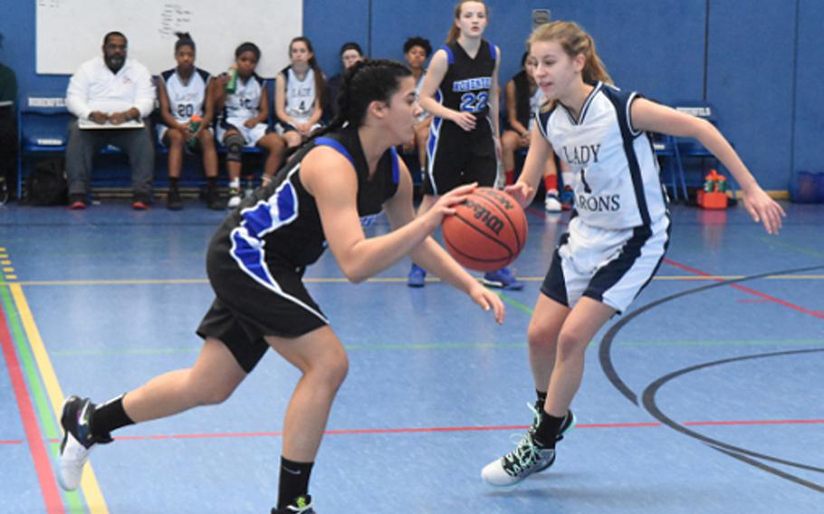 Hohenfels Tiger Alondra Saranno-Velez charges past Bitburg's Ava Bohn during a DODEA-Europe girls basketball game Saturday at Hohenfels, Germany.