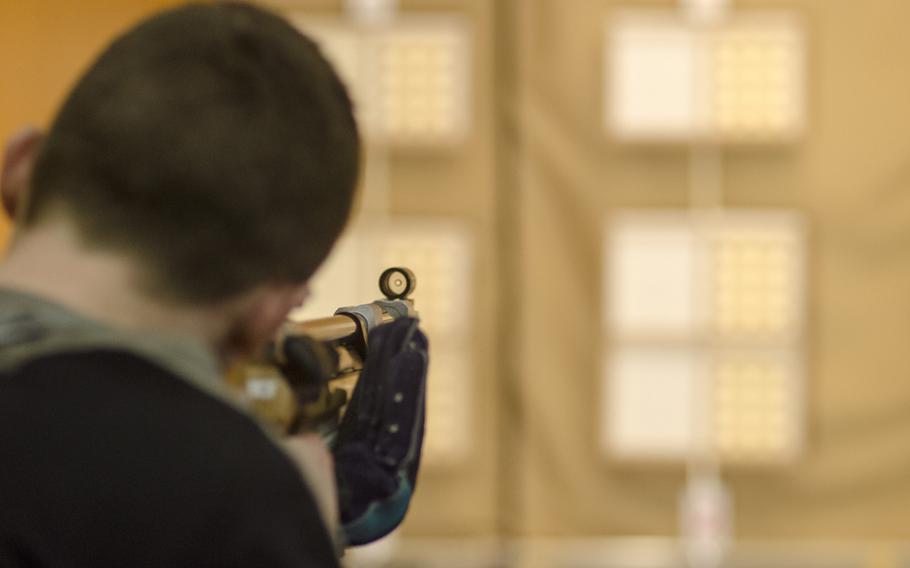 James Wagenblast of Wiesbaden looks down his air rifle sights during a conference marksmanship competition in Wiesbaden, Saturday, Jan. 21, 2017. Wagenblast's varsity team finished third in the competition with a combined score of 1,074.