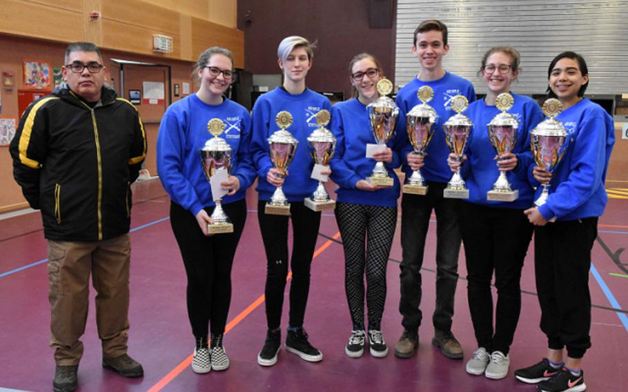 Coach Raul Pinon and the Stuttgart marksmanship team show off all the trophies they won at the European Marksmanship championship on Saturday.