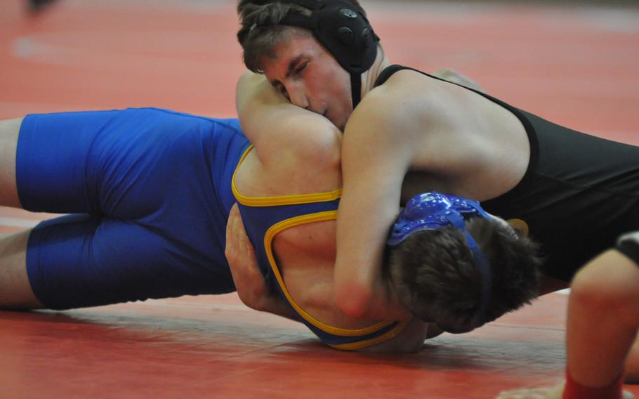 Vicenza's Trey Brock starts to turn Sigonella's Sam Jarvis onto his back in a 138-pound match Saturday at Aviano Air Base, Italy.