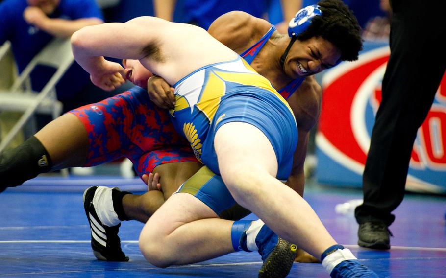 Ramstein's Damante Cross, right, and Wiesbaden's Deven Holland grapple at Ramstein Air Base, Germany, on Saturday, Feb. 11, 2017.