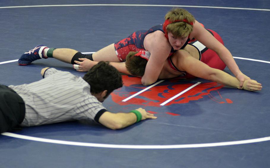 Lakenheath wrestler Joseph Glenk pins Kaiserslautern's Hunter Wiles during the northern sectionals at RAF Lakenheath, Saturday, Feb. 11, 2017. 