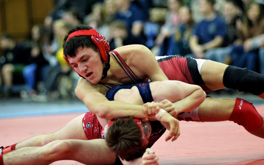 Kaiserslautern wrestler Conner Mackie works against Lakenheath's Kyle Boren for a hard-earned pin during the Northern wrestling sectionals at RAF Lakenheath, Saturday, Feb. 11, 2017.