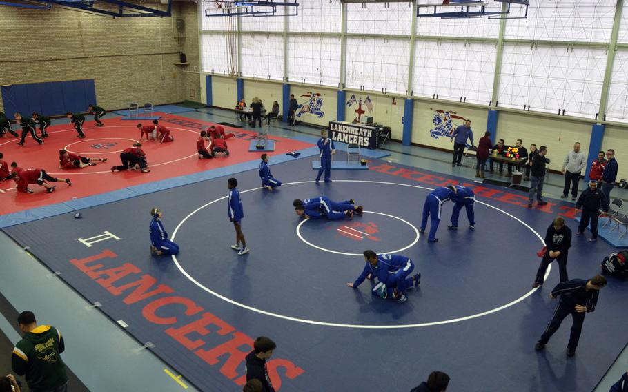 Wrestlers warm-up at RAF Lakenheath high school during the Northern wrestling sectionals, Saturday, Feb. 11, 2017. The Lancers invited Division I foes Kaiserslautern and SHAPE, Bitburg and AFNORTH from Division II and Division III Alconbury and Brussels to battle it out for places at the DODEA-European wrestling championships.