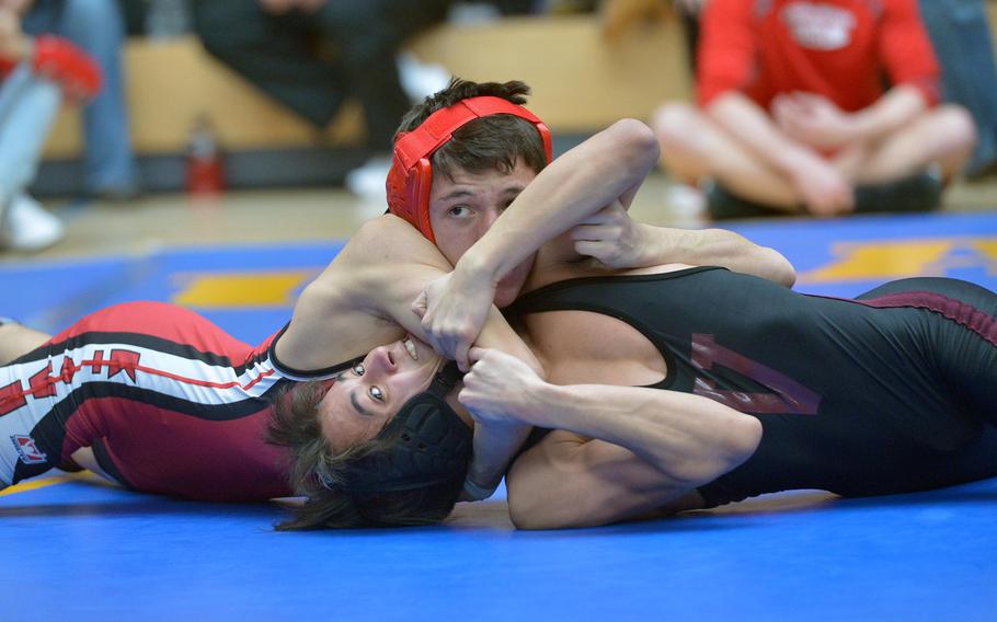 Kaiserslautern's Conner Mackie has a grip on Vilseck's Diego Martinez in a 113-pound third-round match at the DODEA-Europe wrestling championships in Wiesbaden, Germany, Friday, Feb. 17, 2017. Mackie won.


