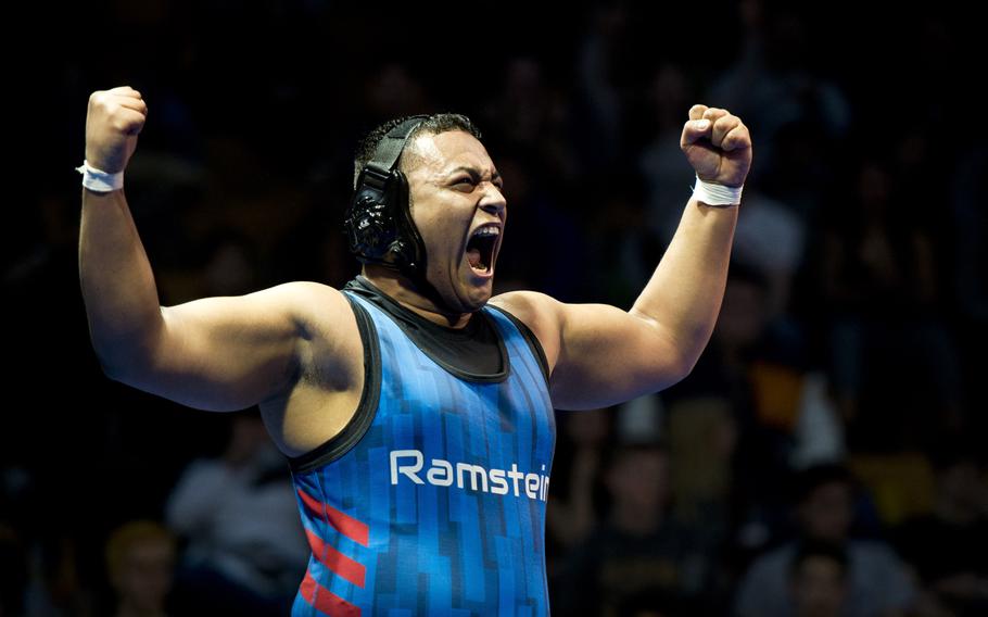 Ramstein's Erik Gerena celebrates winning the 220-pound weight class during the DODEA-Europe wrestling championship in Wiesbaden, Germany, on Saturday, Feb. 18, 2017.