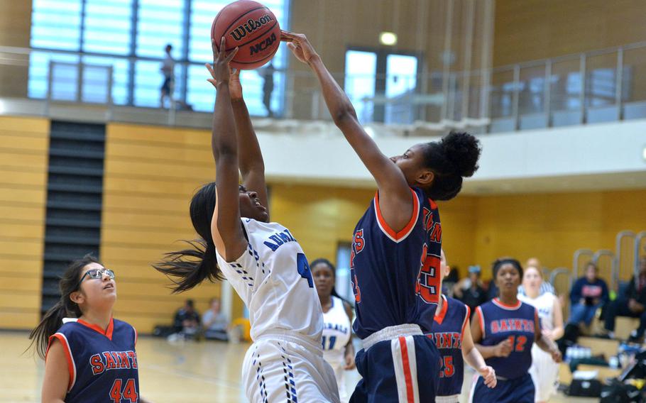 Rota's Shardasia Wilson, left, goes up against Aviano's Shalatheia Thomas in a Division II game at the DODEA-Europe basketball championships in Wiesbaden, Germany, Wednesday, Feb. 22, 2017. Rota won the game27-22.