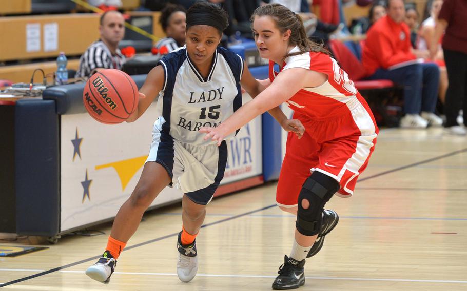 Bitburg's Laila Brown drives the ball up the court against AOSR's Mailea Huber in a Division II semifinal at the DODEA-Europe basketball championships in Wiesbaden, Germany, Friday, Feb. 24, 2017. Bitburg won the game 36-12 to advance to Saturday's final against Black Forest Academy.