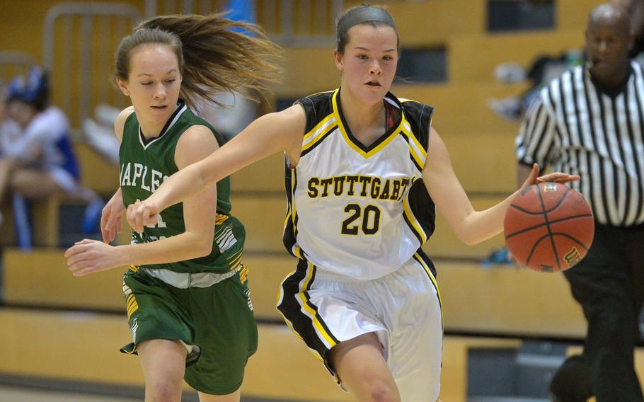 Stuttgart's Meaghan Ambelang drives up court against Naples' Cora Houseworth in a Division I semifinal at the DODEA-Europe basketball championships in Wiesbaden, Germany, Friday, Feb. 24, 2017. Stuttgart beat Naples 43-13 to advance to Saturday's championship game against Ramstein.