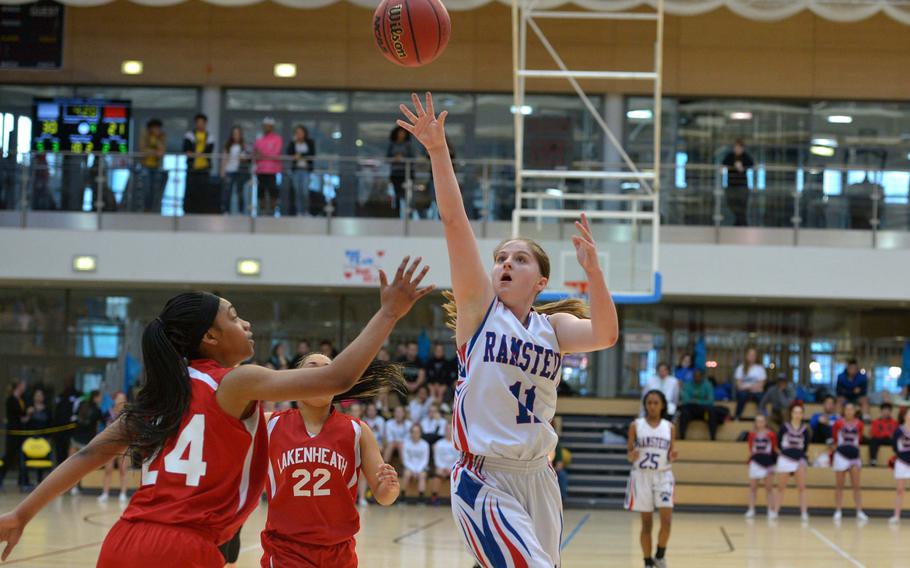 Ramstein's Elizabeth Noel takes a shot over Lakenheath's Gabrielle Clavo in a Division I semifinal at the DODEA-Europe basketball championships in Wiesbaden, Germany, Friday, Feb. 24, 2017. Ramstein beat Lakenheath 31-28 to advance to Saturday's championship game against Stuttgart.