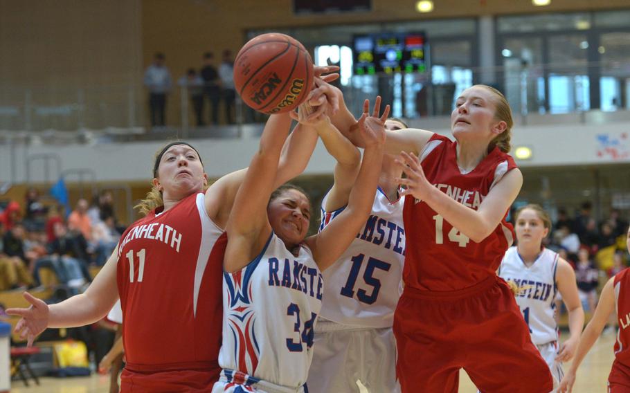 Lakenheath and Ramstein players, from left, Seraphina Raas, Haley Deome, Kaitlyn Daniels and Reese Estus, fight for a rebound in a Division I semifinal at the DODEA-Europe basketball championships in Wiesbaden, Germany, Friday, Feb. 24, 2017. Ramstein beat Lakenheath 31-28 to advance to Saturday's championship game against Stuttgart.