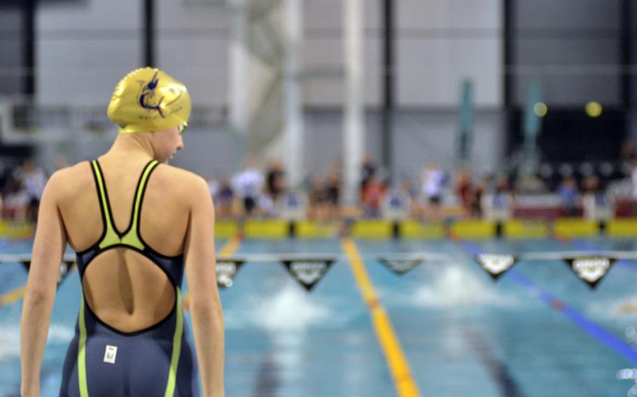 Marlins swimmer Thila Van Dongen checks out her competition during the mixed 15-19 age group 200-meter medley relay at the European Forces Swim League championships in Eindhoven, Netherlands, Saturday, Feb. 25, 2017. 