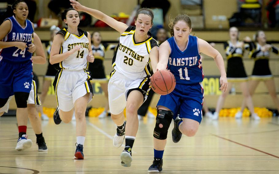Ramstein's Elizabeth Noel, right, and Stuttgart's Meaghan Ambelang race for the ball during the DODEA-Europe Division I championship in Wiesbaden, Germany, on Saturday, Feb. 25, 2017.