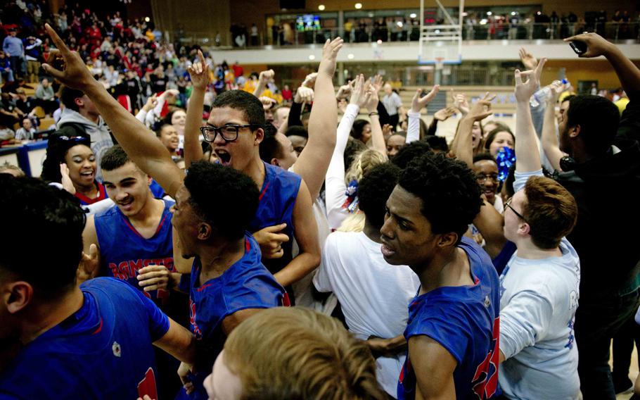 Ramstein celebrates winning the DODEA-Europe Division I championship in Wiesbaden, Germany, on Saturday, Feb. 25, 2017. Ramstein defeated Wiesbaden 48-46 to win the title.