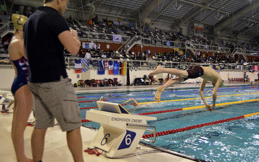 Marlins Coach Lieven Willems runs swimmers through warm-ups during the final day of the annual European Forces Swim League championships in Eindhoven, Netherlands, Sunday, Feb. 26, 2017. More than 2,000 individual entries into the pool left 20 event records broken.