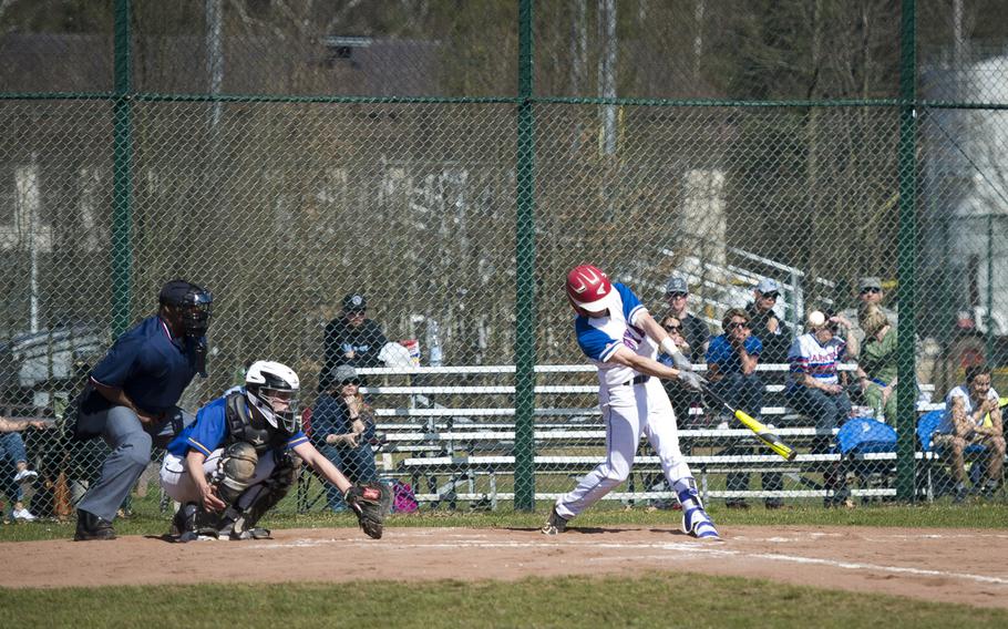 Ramstein's Aaron Schlosser gets a hit at Ramstein Air Base, Germany, on Thursday, March 30, 2017. Ramstein lost game one of the doubleheader against Wiesbaden 4-1, but won game two 13-3.
