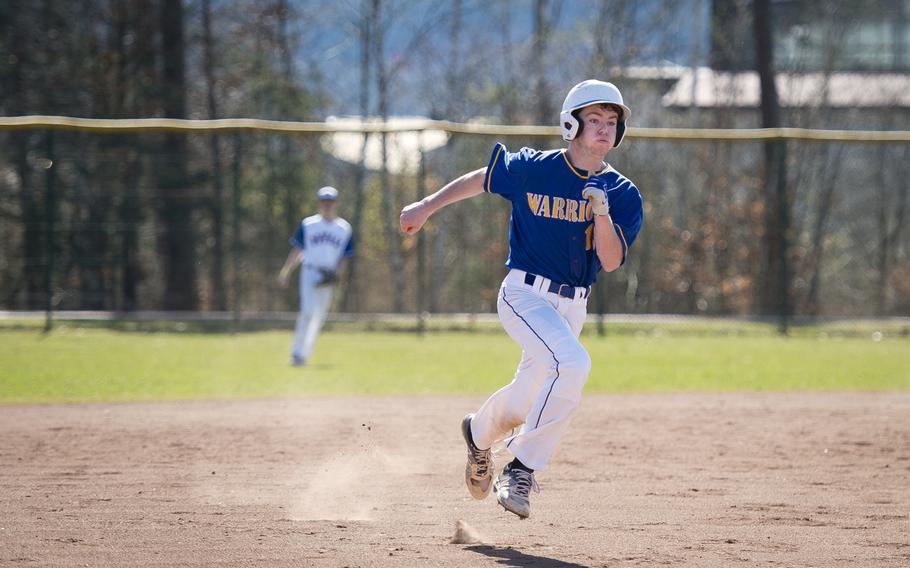 Wiesbaden's Gunner Yingling runs to third at Ramstein Air Base, Germany, on Thursday, March 30, 2017.
