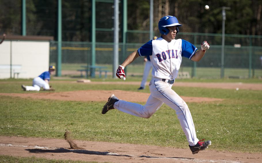 Ramstein's Stanley Cruz runs to first ahead of the ball at Ramstein Air Base, Germany, on Thursday, March 30, 2017. Ramstein lost game one of the doubleheader against Wiesbaden 4-1, but won game two 13-3.
