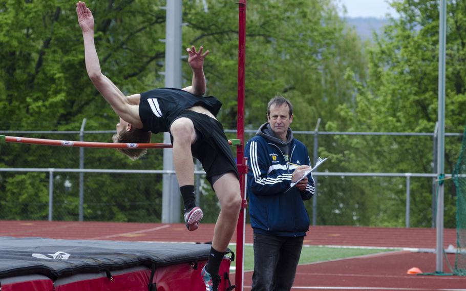 Robert Baumback of Stuttgart clears the bar in the high jump event at a seven-team meet Saturday, April 15 in Wiesbaden, Germany. Baumback tied for second behind Kaiserslautern's Olivar Powder with a jump of 4 feet, 11 inches.
