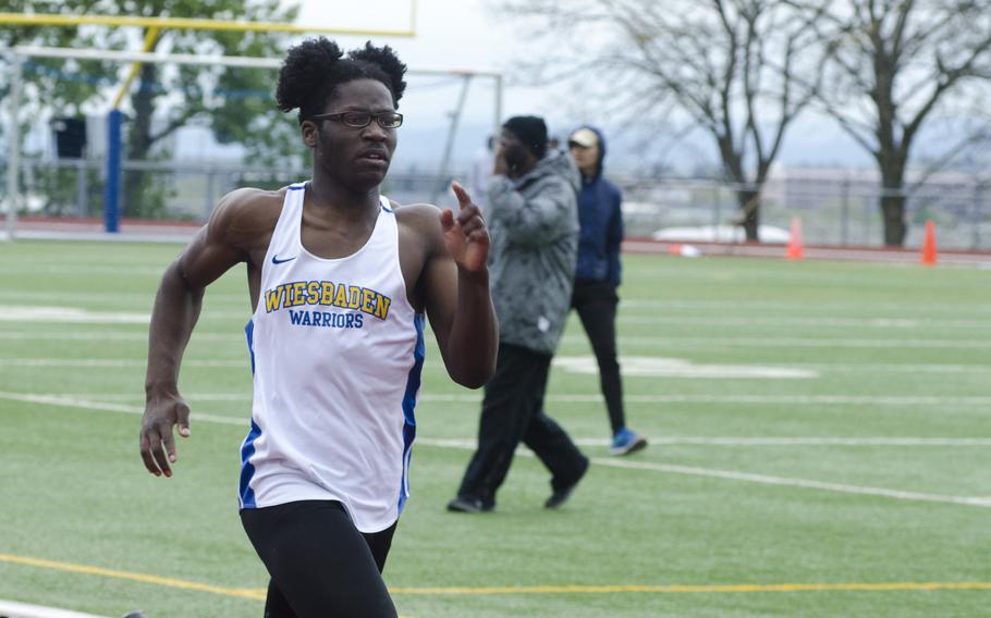 Caleb Brown of Wiesbaden sprints to the finish line of the 400-meter dash at a seven-team meet Saturday, April 15 in Wiesbaden, Germany. Brown took first place in the event with a time of 52.47.